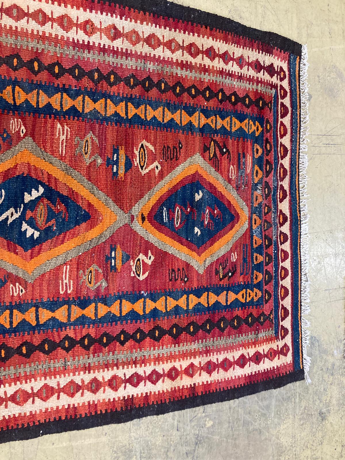 A polychrome Kelim rug, 270 x 134cm.